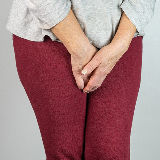 Continence Management woman holding self