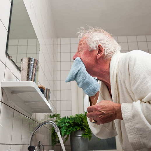 Personal Hygiene assistance elderly man drying off