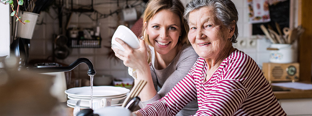 home caretaker helping with dishes IADLs